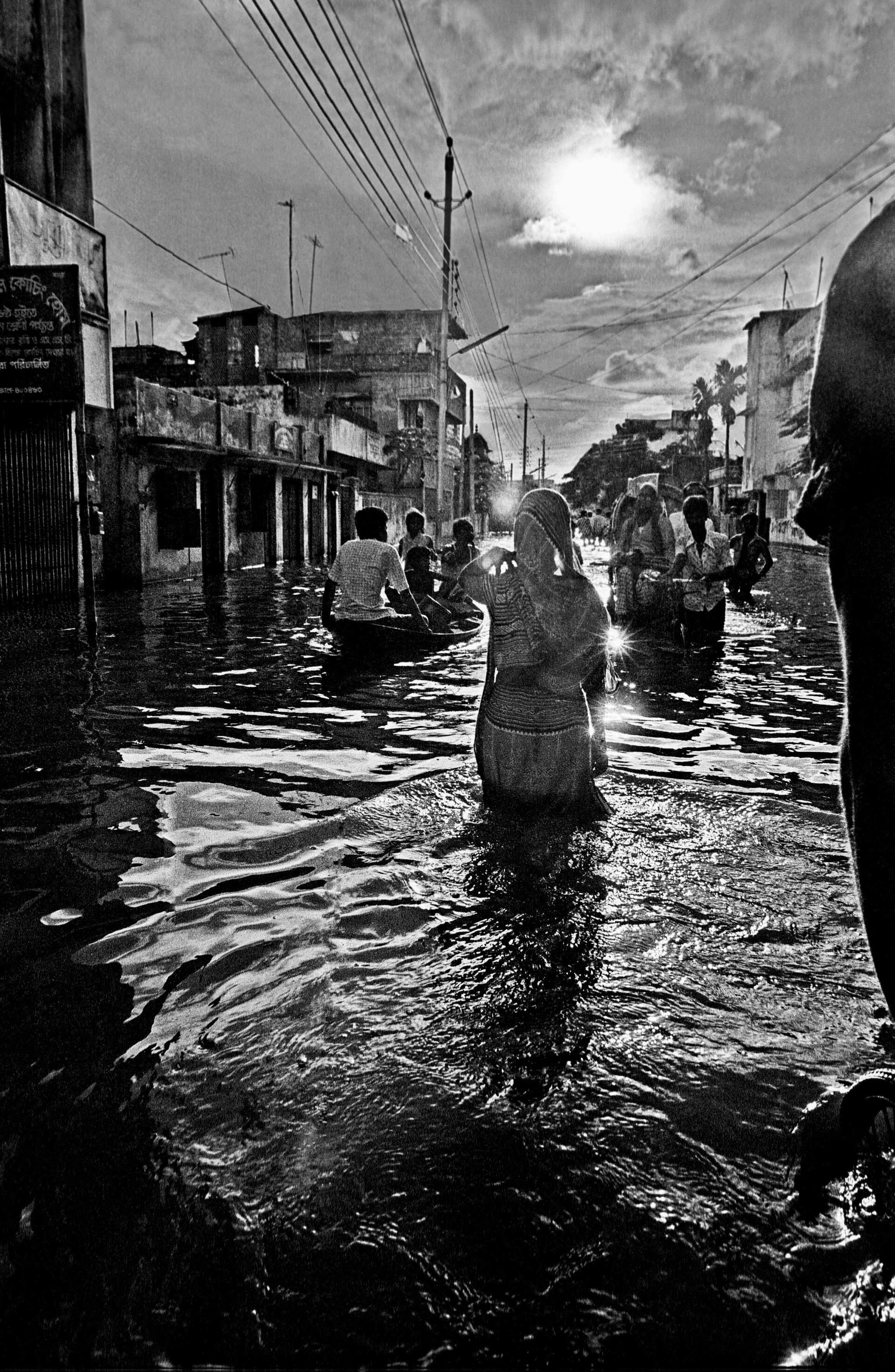 Shahid_Woman wading in flood 1988